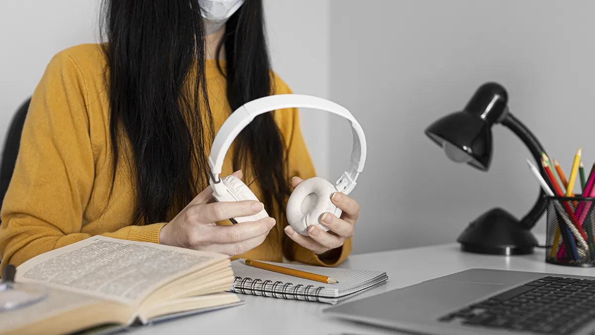 close-up-hands-holding-headphones copy